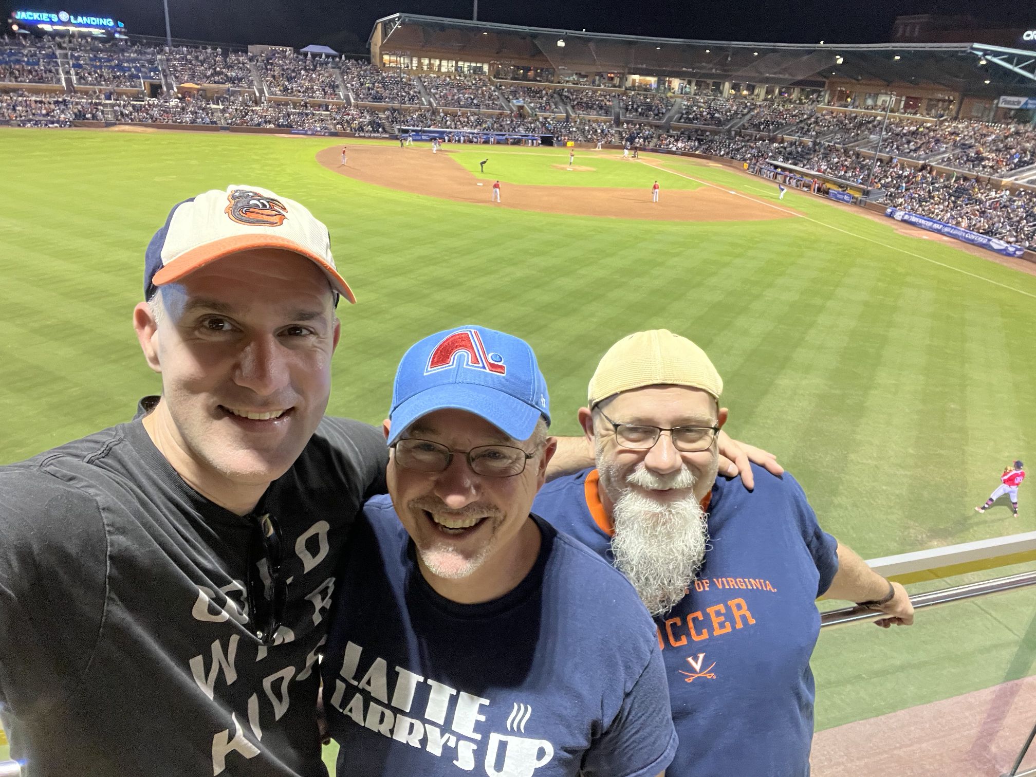 Three guys at a Durham Bulls baseball game.